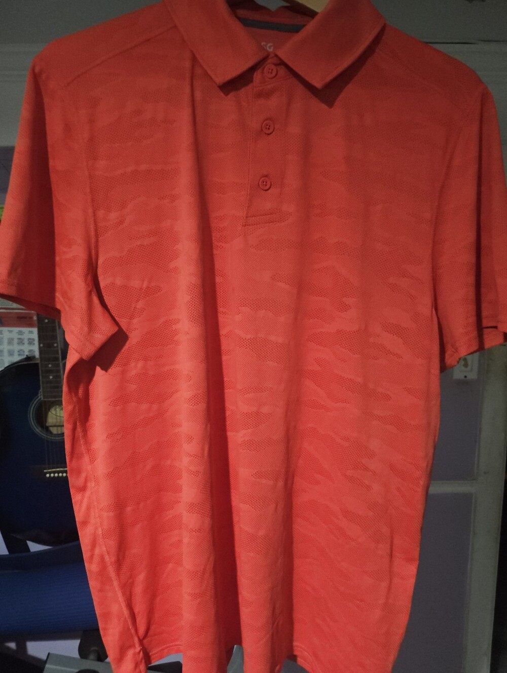 DSG Orange Men's Polo with Subtle Pattern